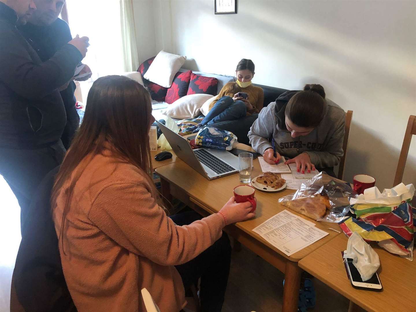 Ukrainian refugees signing immigration papers in one of Nathan Fenn's Bulgarian holiday apartments