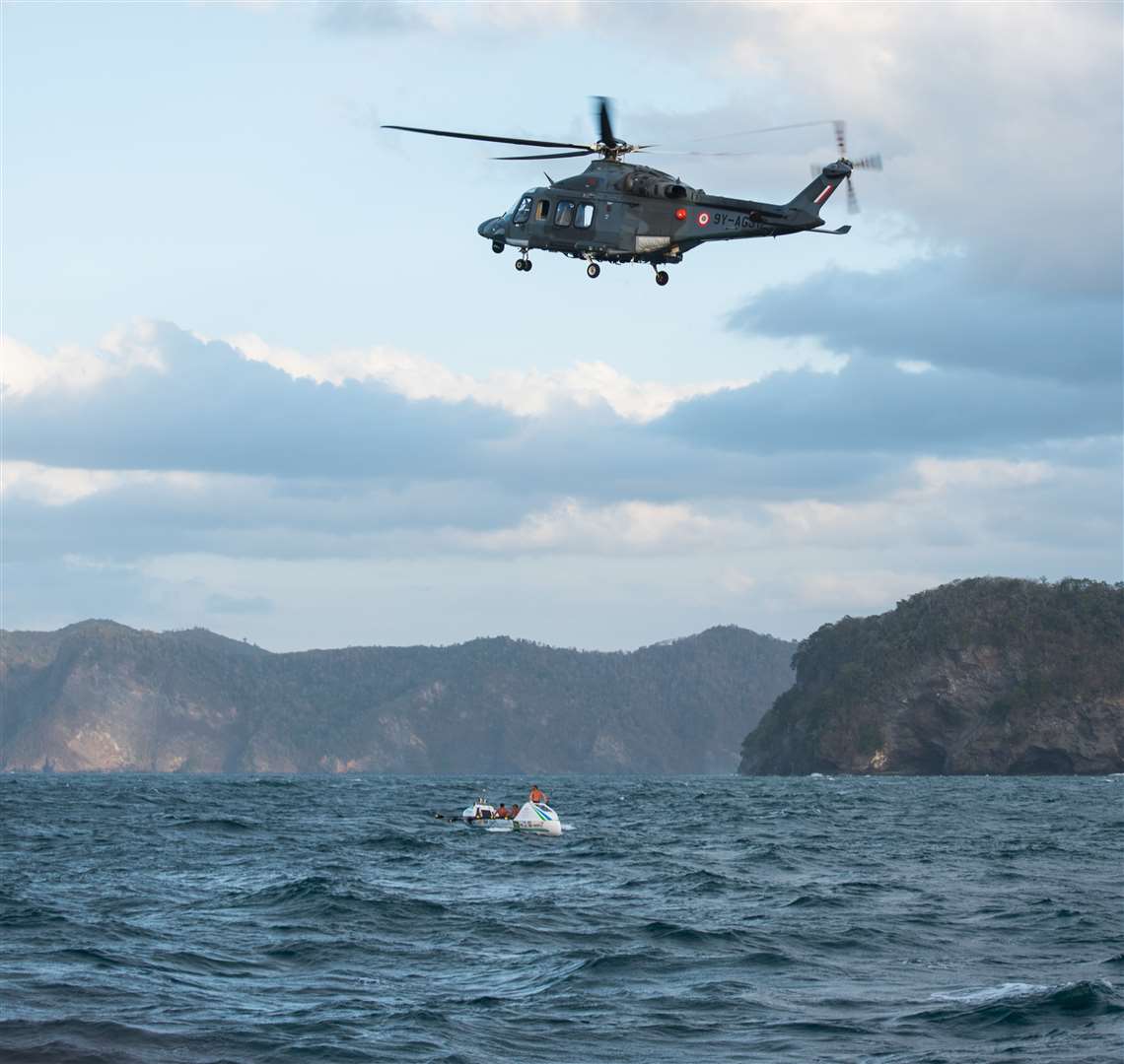 Trinidad coast guard assisting the team get to land safely
