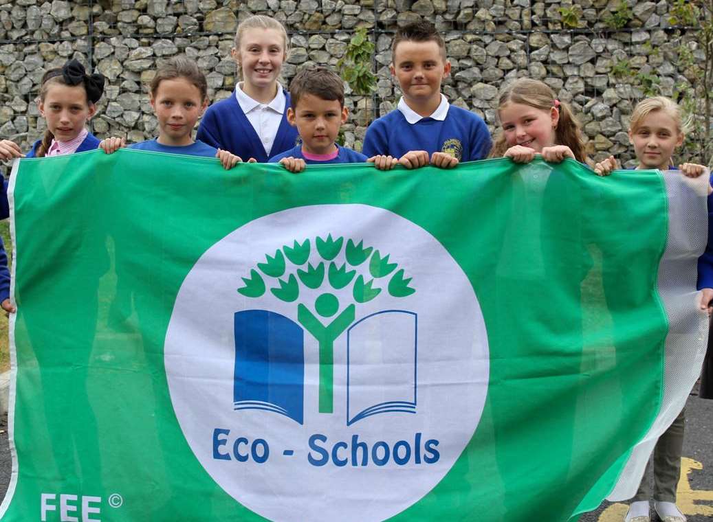 Eastchurch Primary School pupils with its eco flag