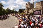 People watched the big screen at Rochester Castle before the riders arrive. Picture: JIM RANTELL