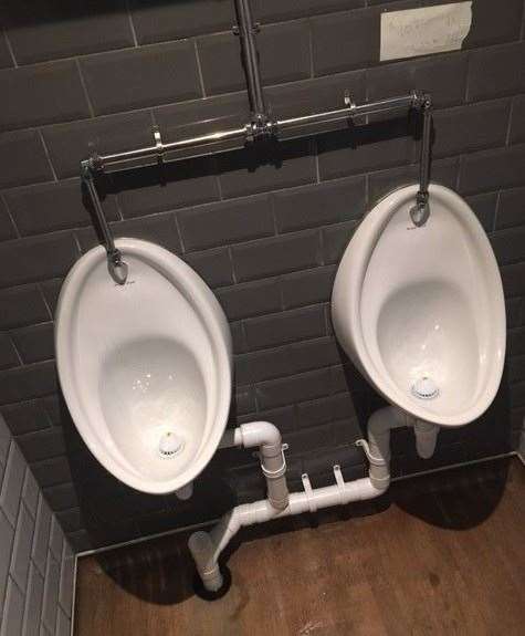 There was a hand-written sign saying the urinal on the right should not be used but the one on the left leaks like a sieve