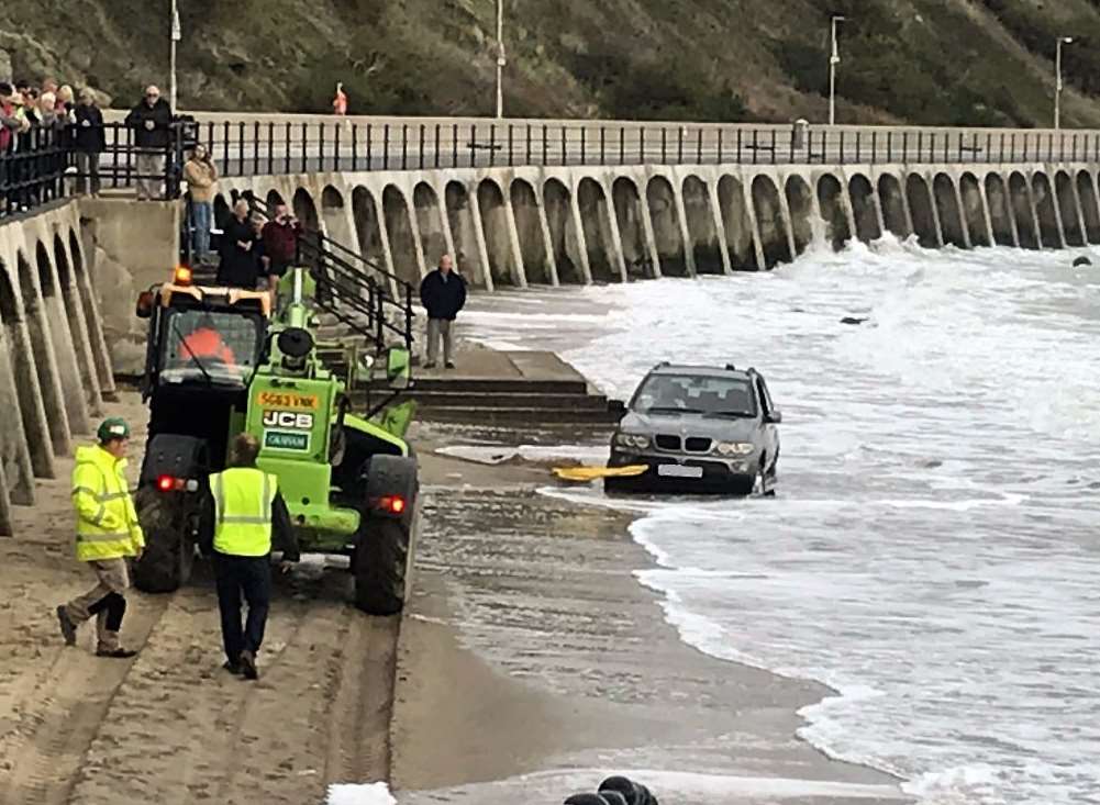 The BMW had to be pulled to safety by a JCB. Pic: Folkestone Coastguard