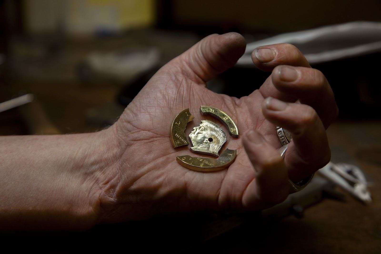 A memorial coin bearing president Donald Trumps face is being converted into a unique acessory. (12299056)