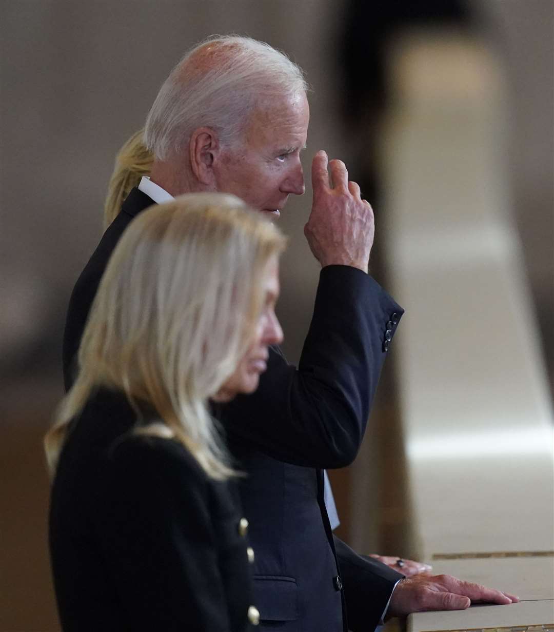 Joe Biden views the coffin (Jacob King/PA)