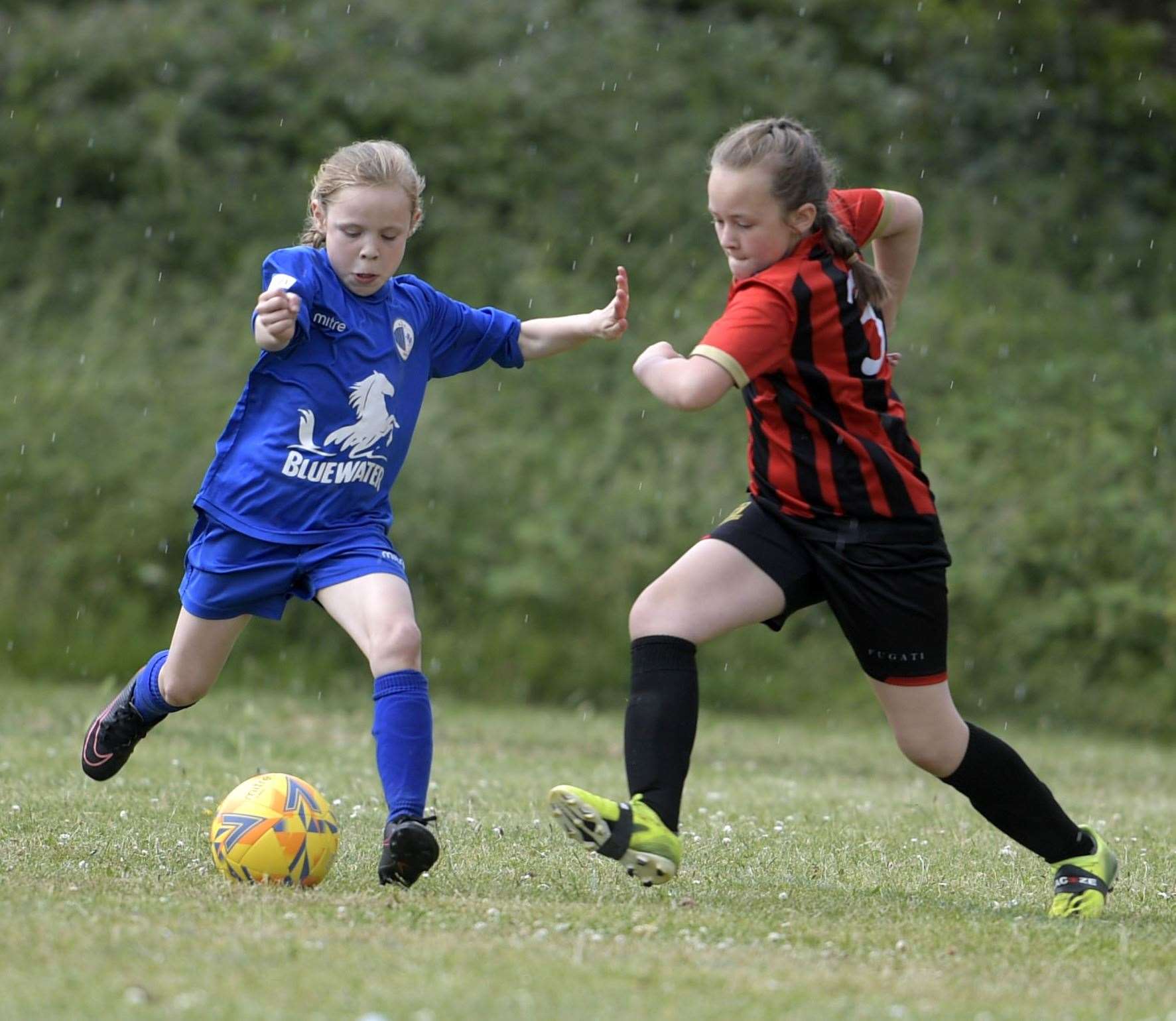 Sittingbourne Ladies (red) take on Kent Football United at the Larkfield summer tournament. Picture: Barry Goodwin