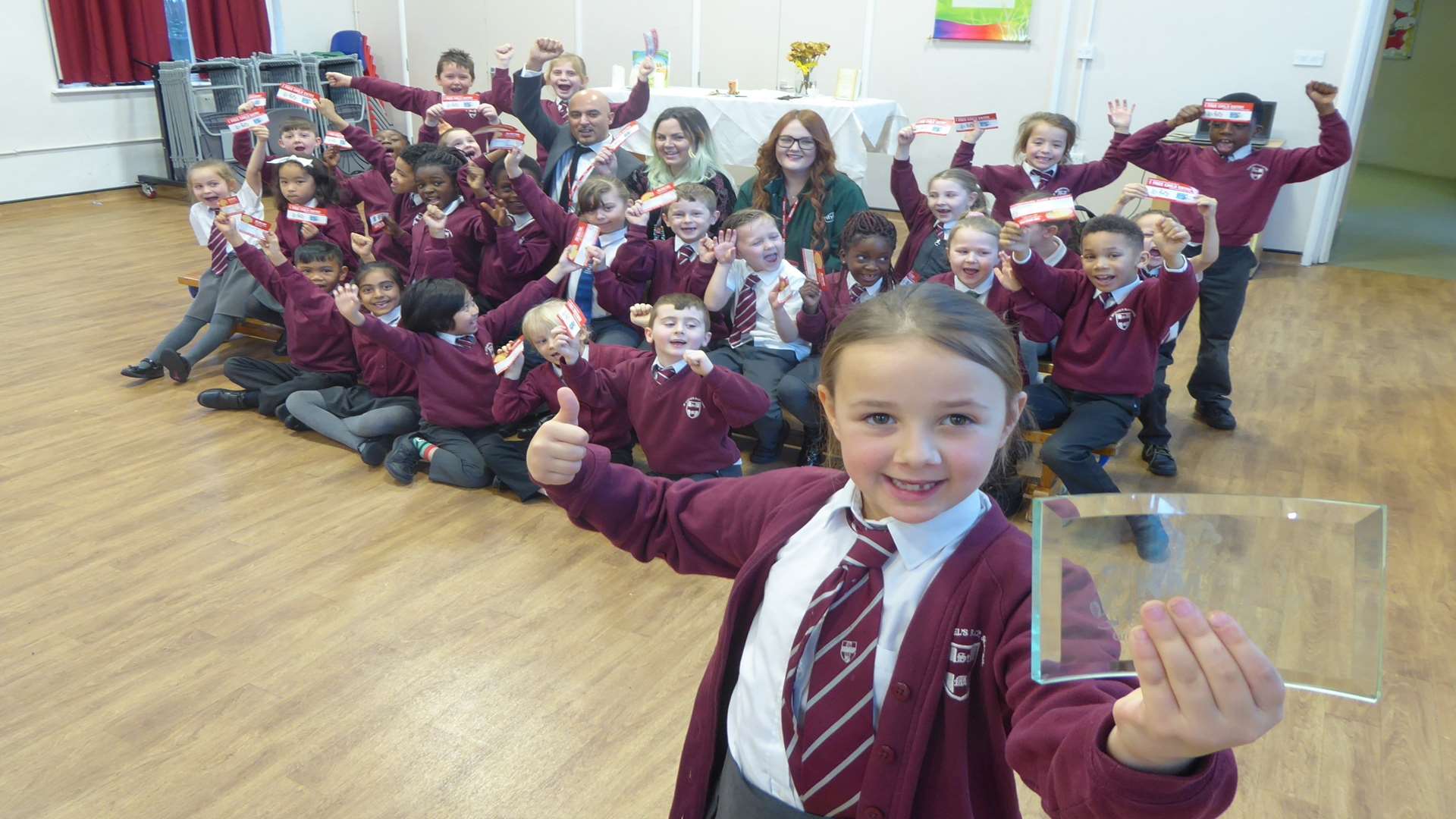Hollie Scrivener, 7, and St Matthew Class celebrate being walk to school class of the week at St Michael's School, Chatham.
