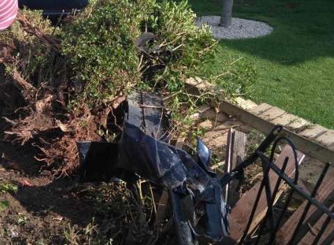 Uprooted garden fence. Picture: Charlie McShane via Twitter