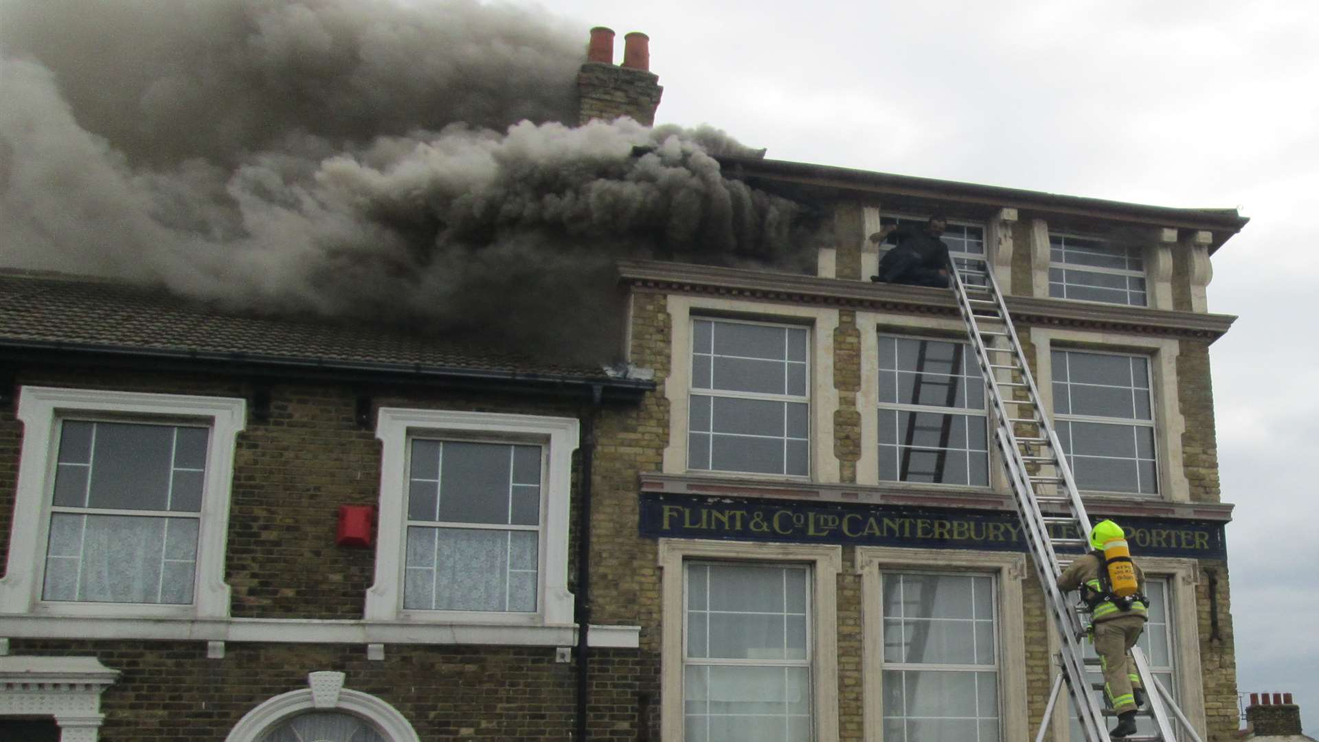Firefighters scale the building on fire in Sheerness