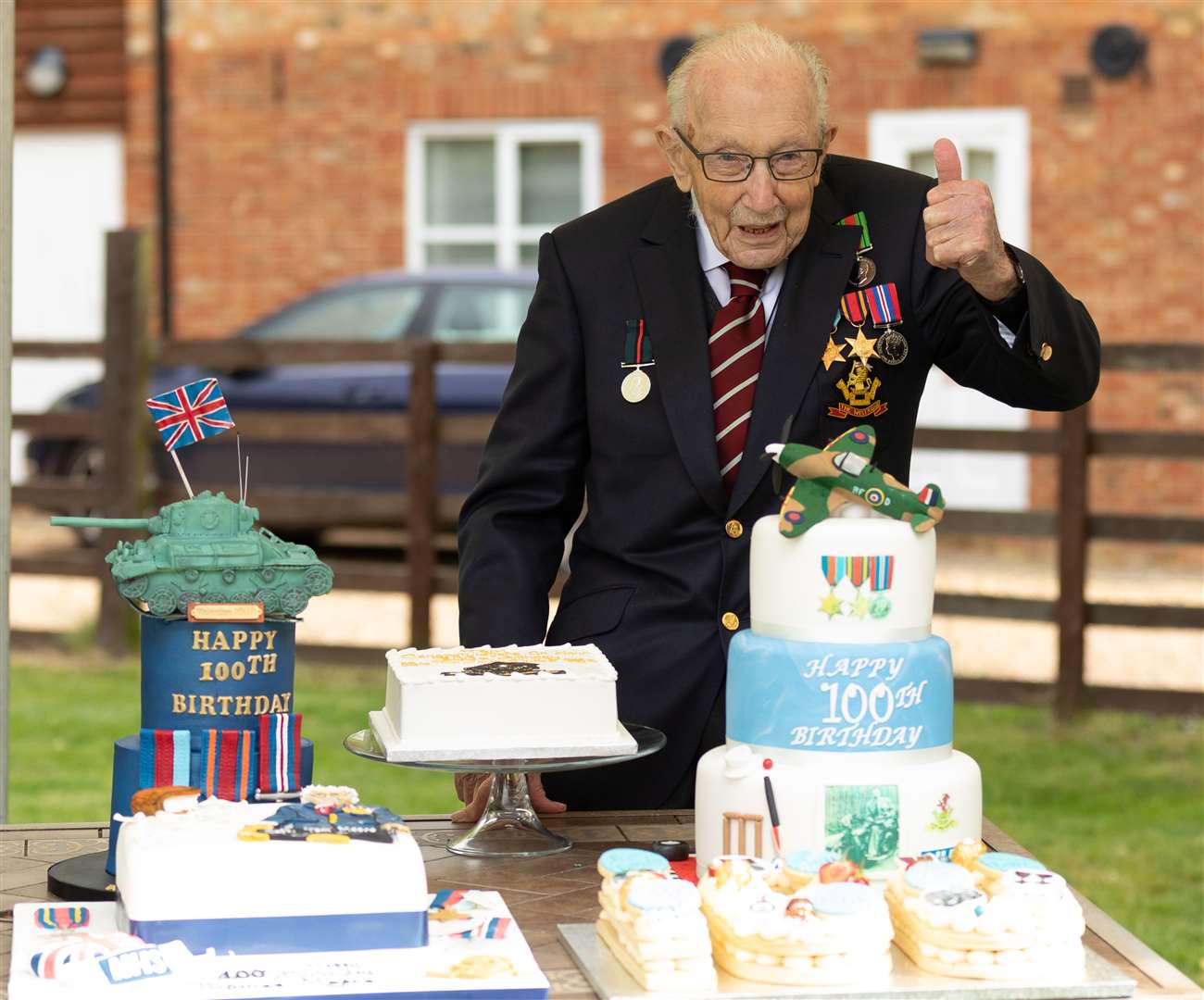 He celebrated his 100th birthday with some impressive-looking cakes (Emma Sohl/Capture the Light Photography/PA)