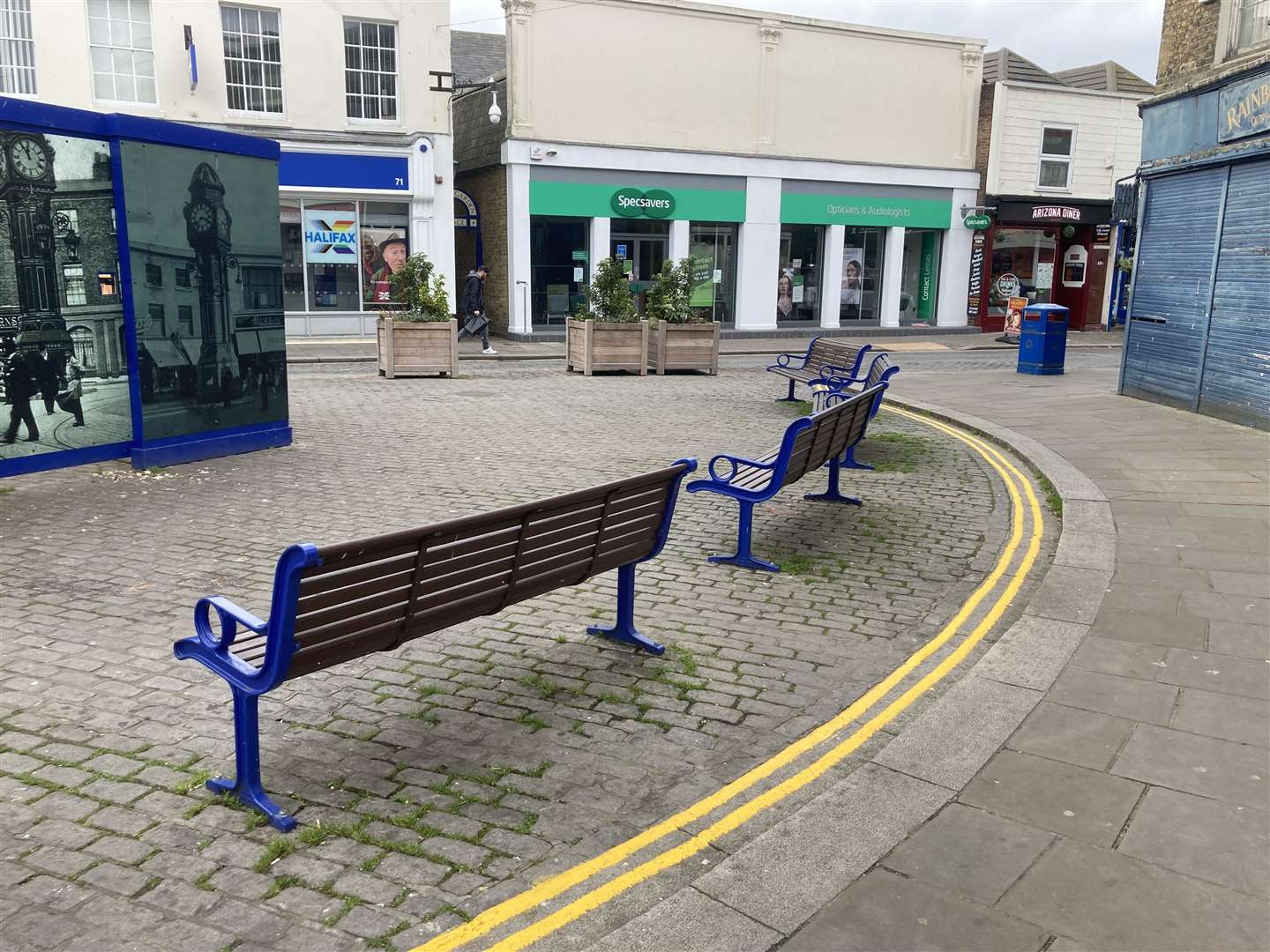Double yellow lines painted around benches in the pedestrianised area of Sheerness town centre by the clock tower