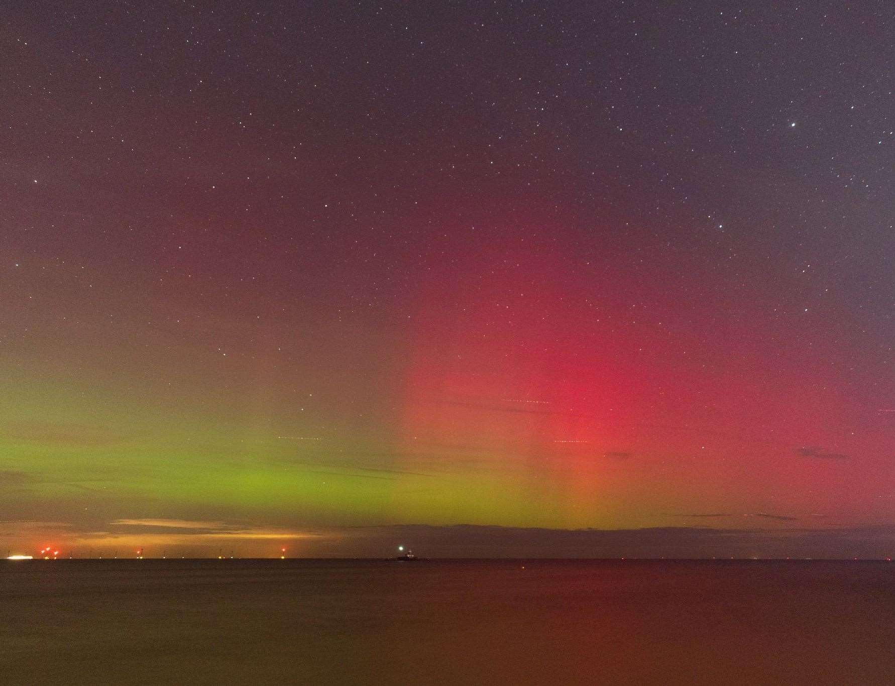 Jamie McBean took a picture of green, red and magenta lights illuminating the skies in Herne Bay. Picture: Jamie McBean