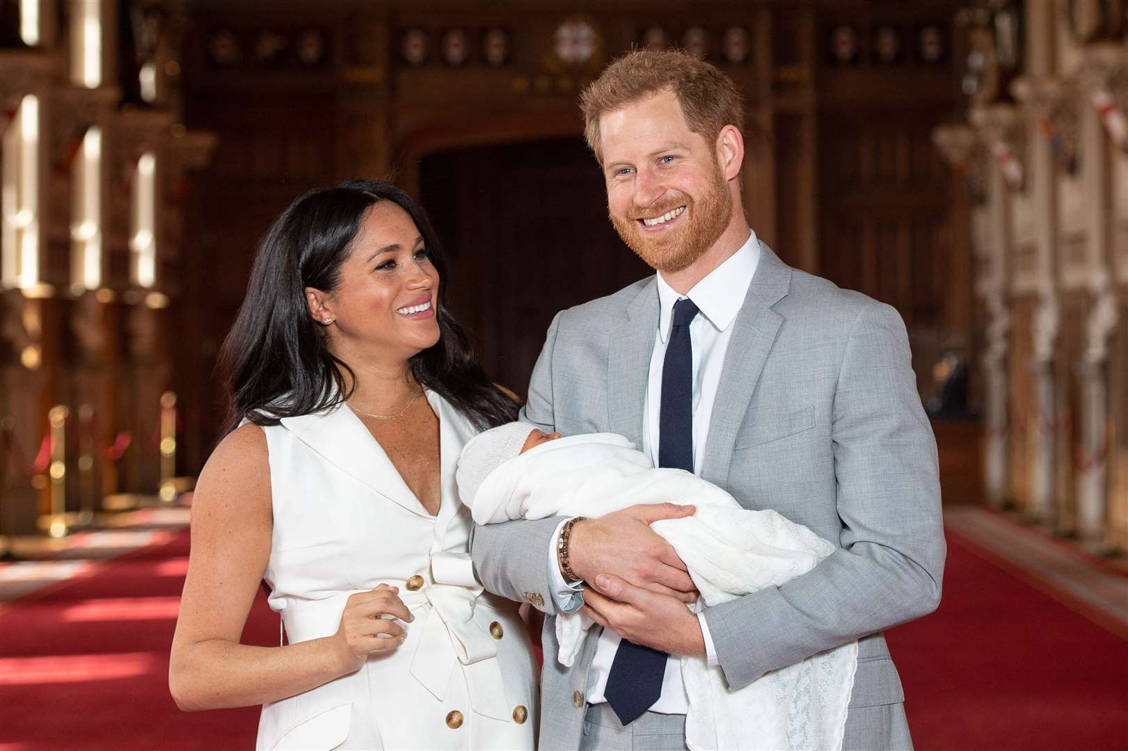 The proud parents with Archie (Dominic Lipinski/PA)