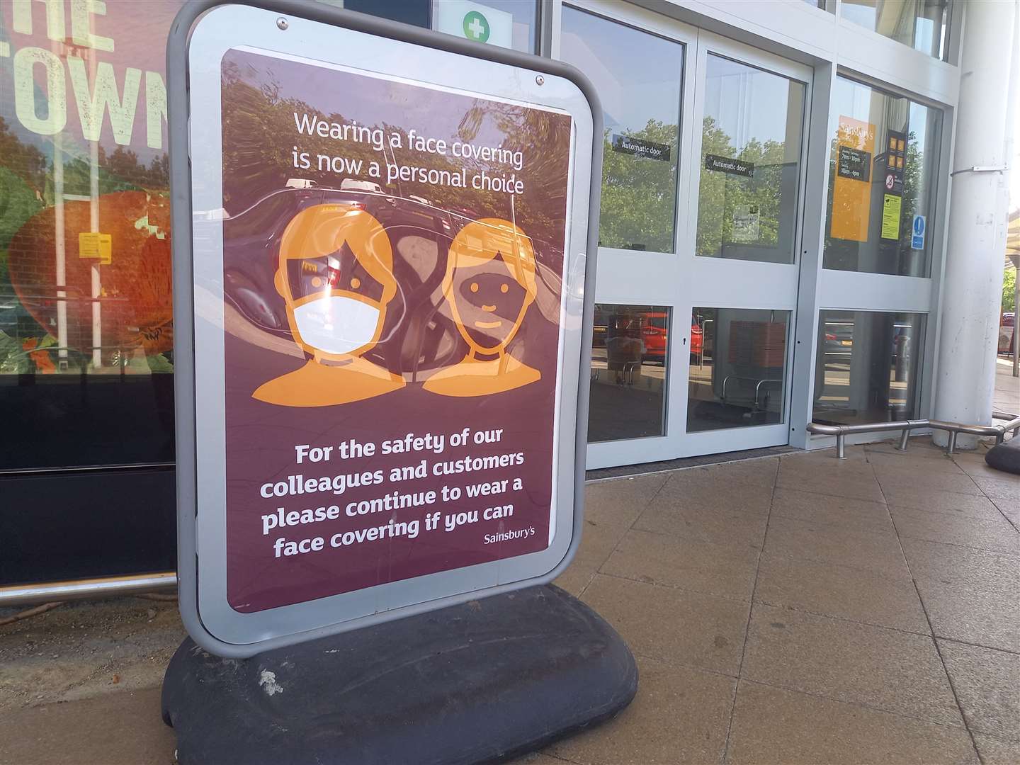 A sign asking people to wear face masks outside Sainsbury's