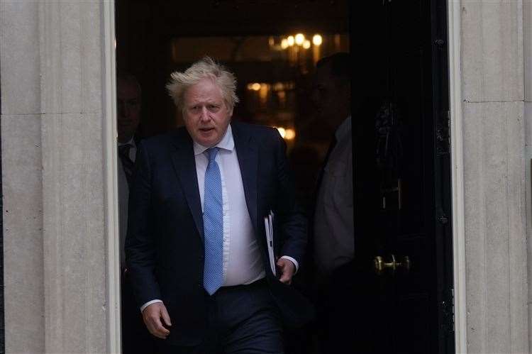 Prime Minister Boris Johnson leaving No 10 to address MPs (Victoria Jones/PA)