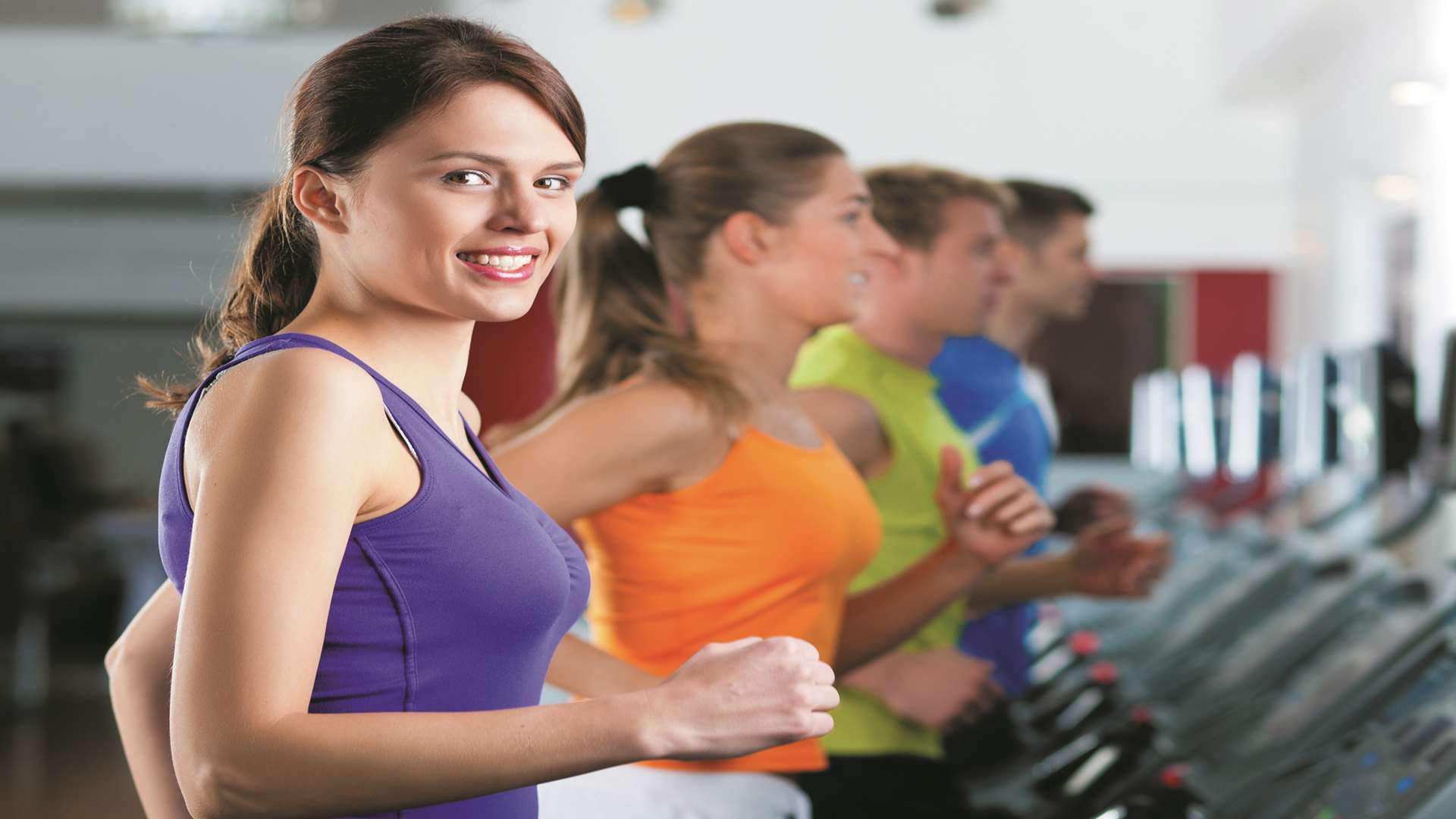 People in a gym on treadmill. Stock image