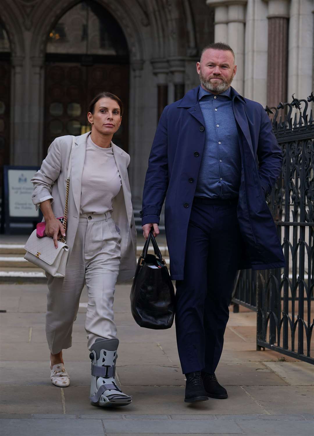 Coleen and Wayne Rooney leave the Royal Courts Of Justice (Yui Mok/PA)