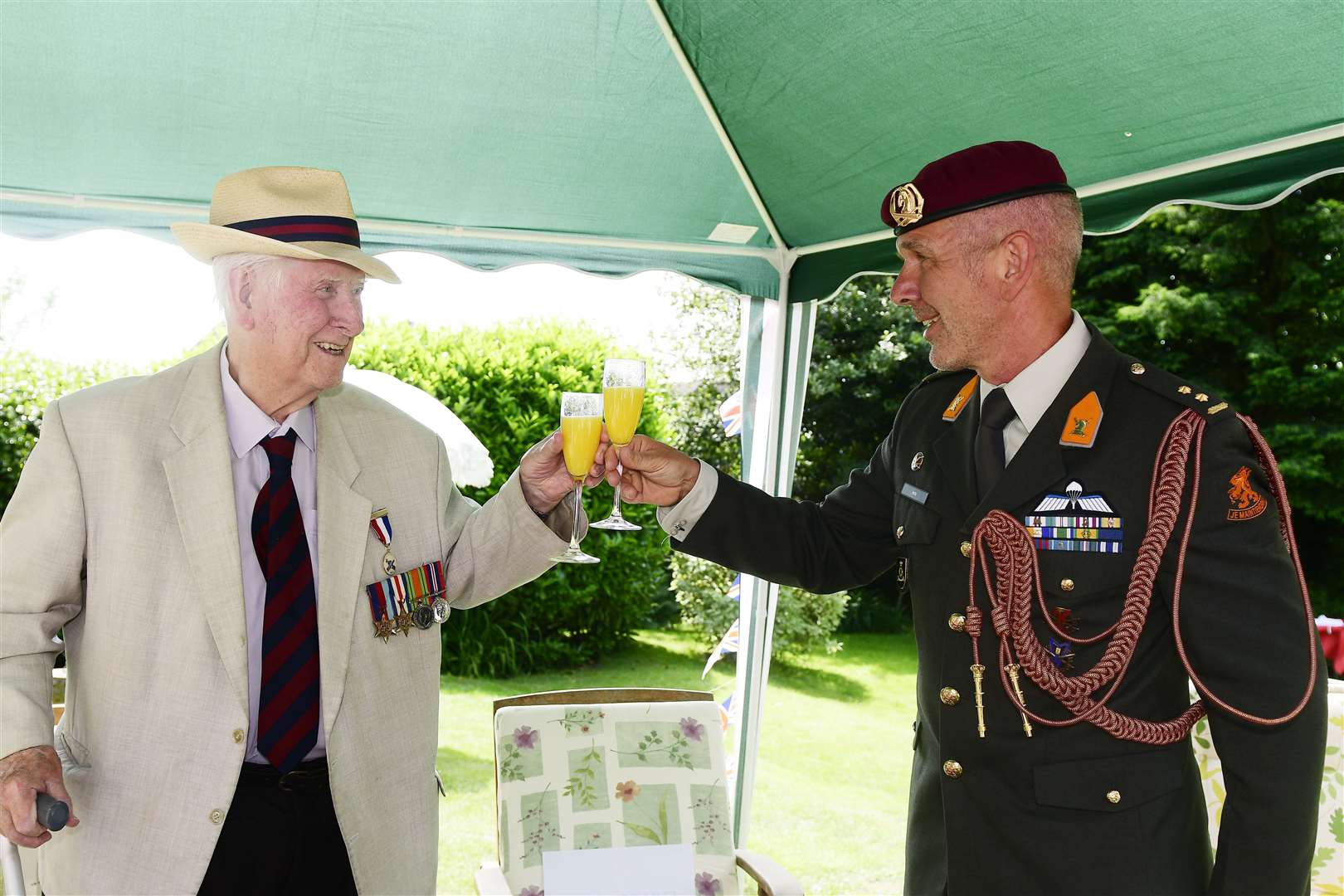 Roy Cook, left, and Lieutenant Colonel Rob Arts raise a glass to the moment. Picture: Barry Goodwin