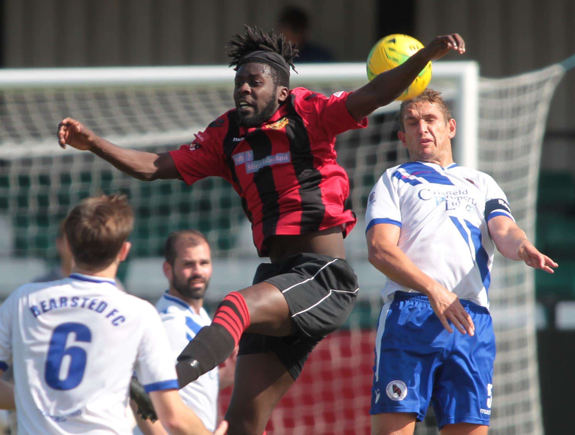 Sittingbourne striker Bola Dawodu challenges in the air. Picture: John Westhrop