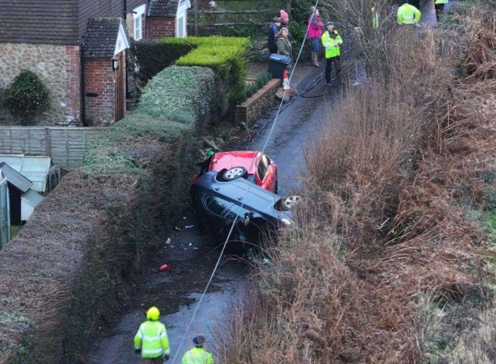 Emergency services were called after a car overturned in Lenham Road, Platts Heath. Picture: UKNIP