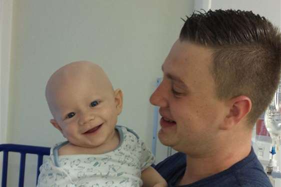 One-year-old Jacob Hughes, who suffers from a rare form of cancer and is currently undergoing chemotherapy, with his dad Luke