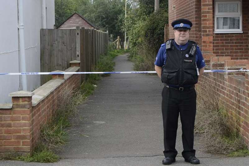 Police stand guard by an alleyway after the allegation. Picture: Gary Browne