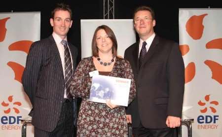 Gravesend Messenger community editor Denise Eaton accepting the award for weekly paid for newspaper of the year, pictured with Derek Lickorish of EDF Energy and Sussex cricketer James Kirtley