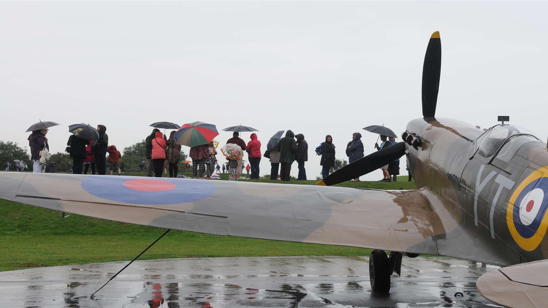 Not even the rain could put the crowds off watching the flypast at the Battle of Britain Memorial. Picture: Wayne McCabe