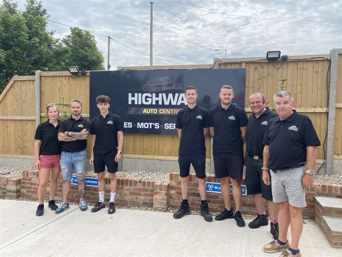 Left to right: Co owners Michelle and Jamie Luck, apprentice Shane Luck, manager Mark Percival, MOT testers Callum Major and Richard Buckler, and former owner David Luck