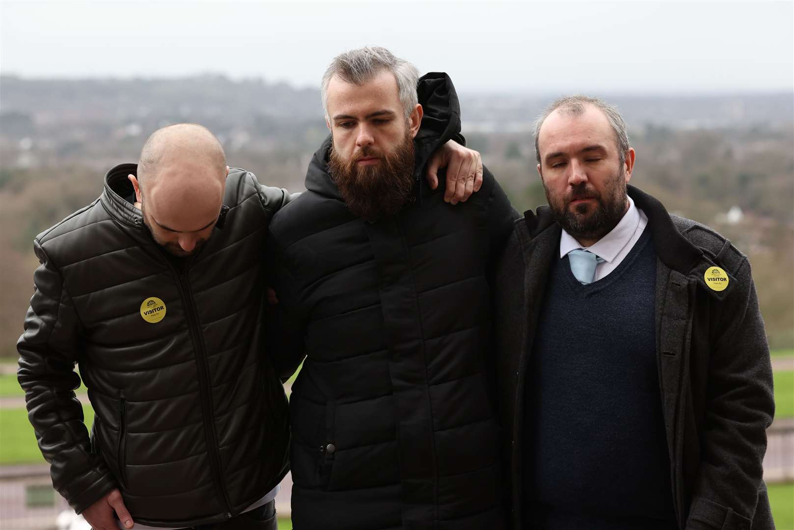 Natalie McNally’s brothers (left to right) Declan, Niall and Brendan during a vigil for women who have died in violent circumstances outside the Parliament Buildings, Belfast. (Liam McBurney/PA)