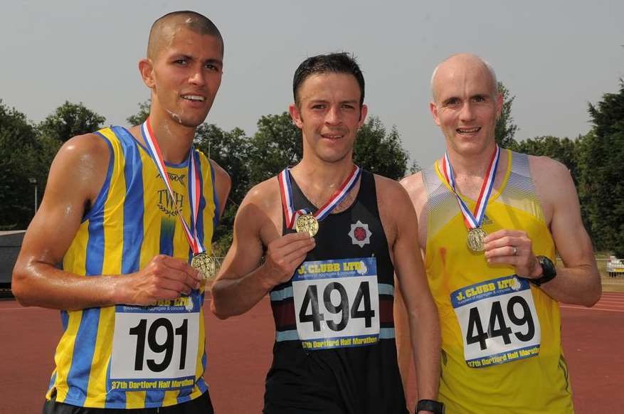 Dartford Half Marathon winner Peter Tucker (centre) with runner-up Dan Watt (left) and third-placed Buz Shepard (right)