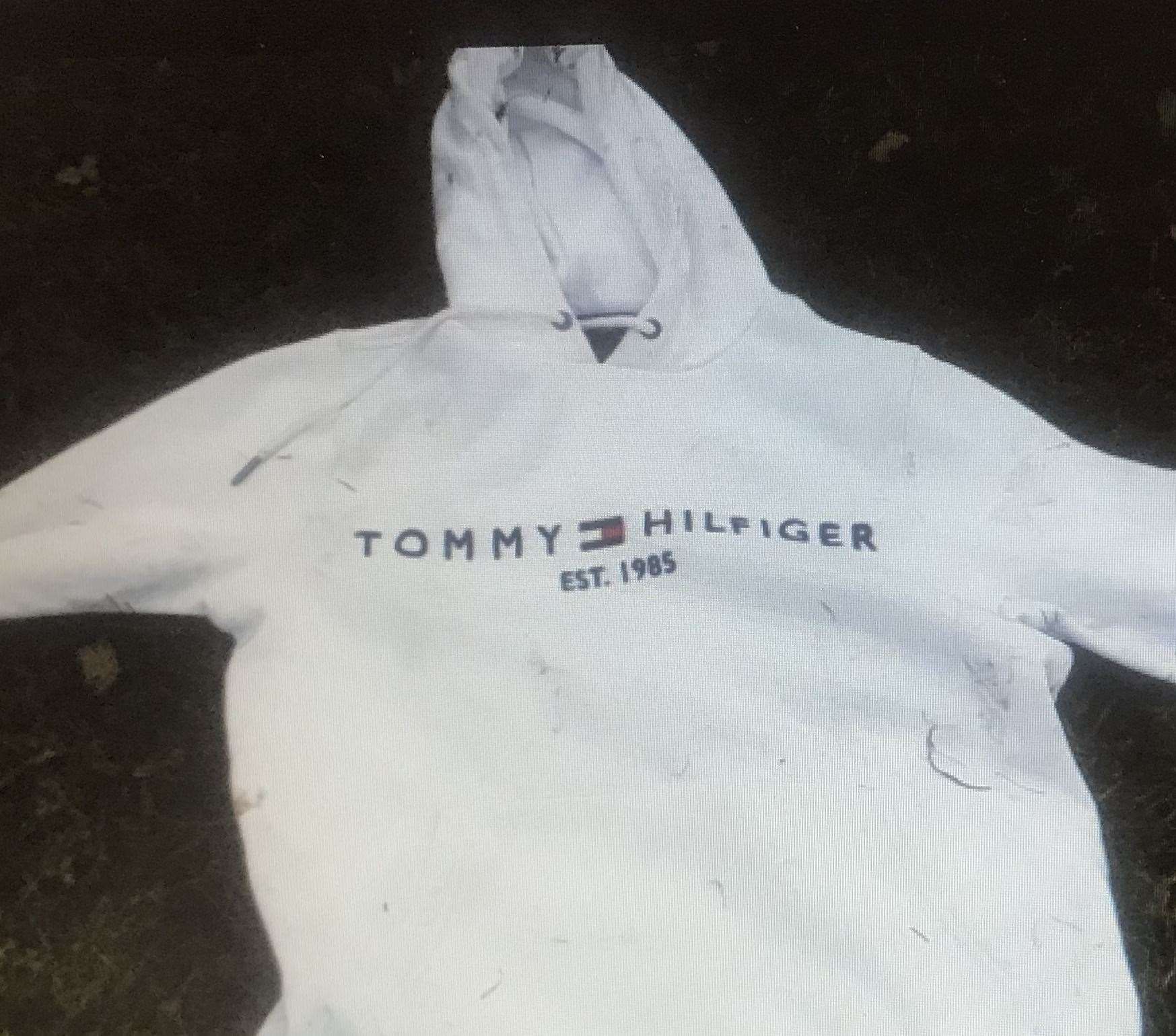 A hoodie dumped in the field