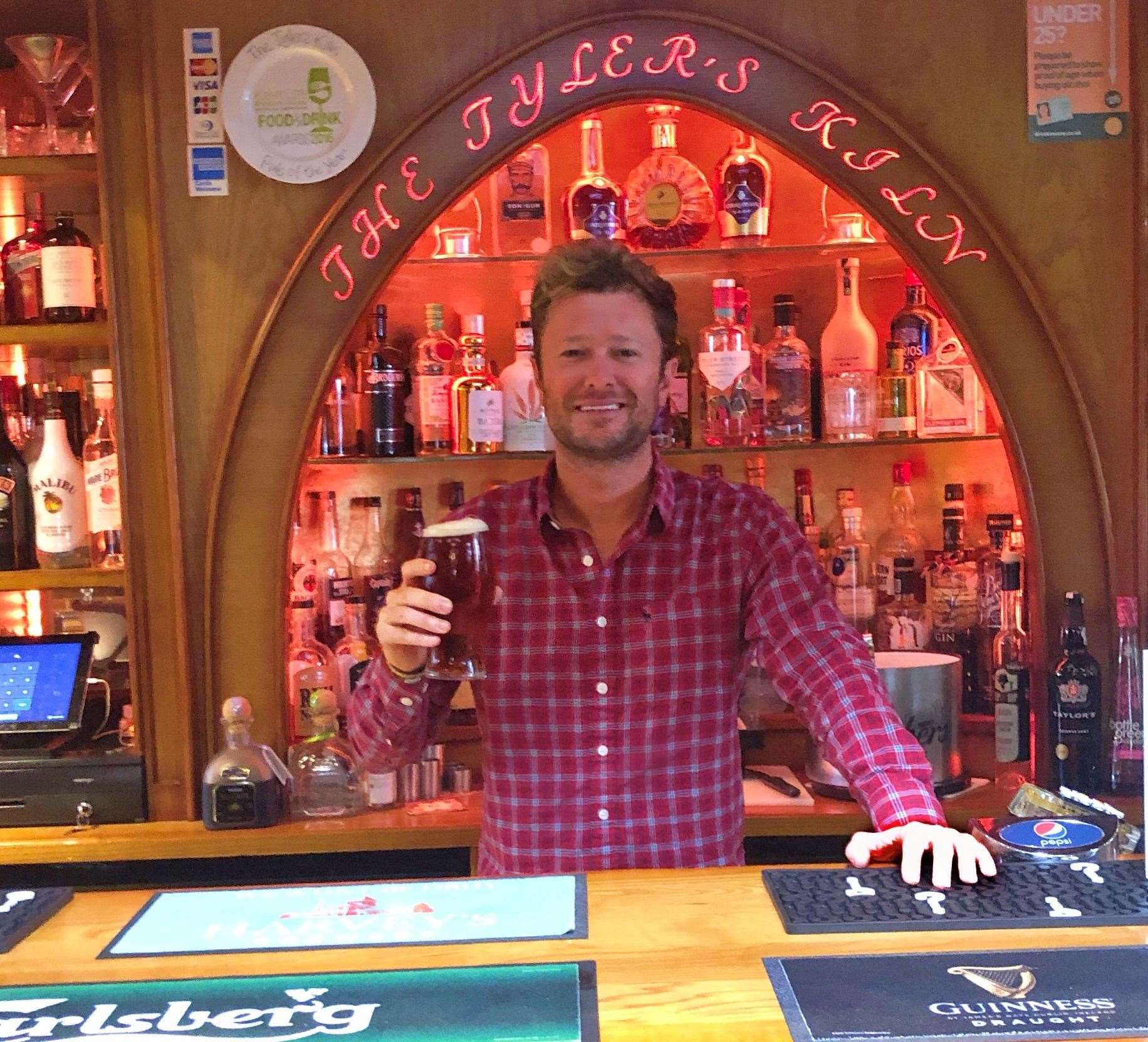Allister Collins, pictured behind the bar at The Tyler's Kiln in 2018
