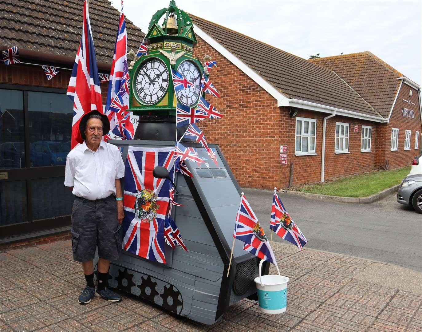 Veteran charity collector and 'inventor' Tim Bell has turned his mobility scooter into a replica of Sheerness clock tower. It made its debut at the Abbey Motel on Friday for the Rotary Club of Minster-on-Sea's Jubilee community awards. Picture: John Nurden