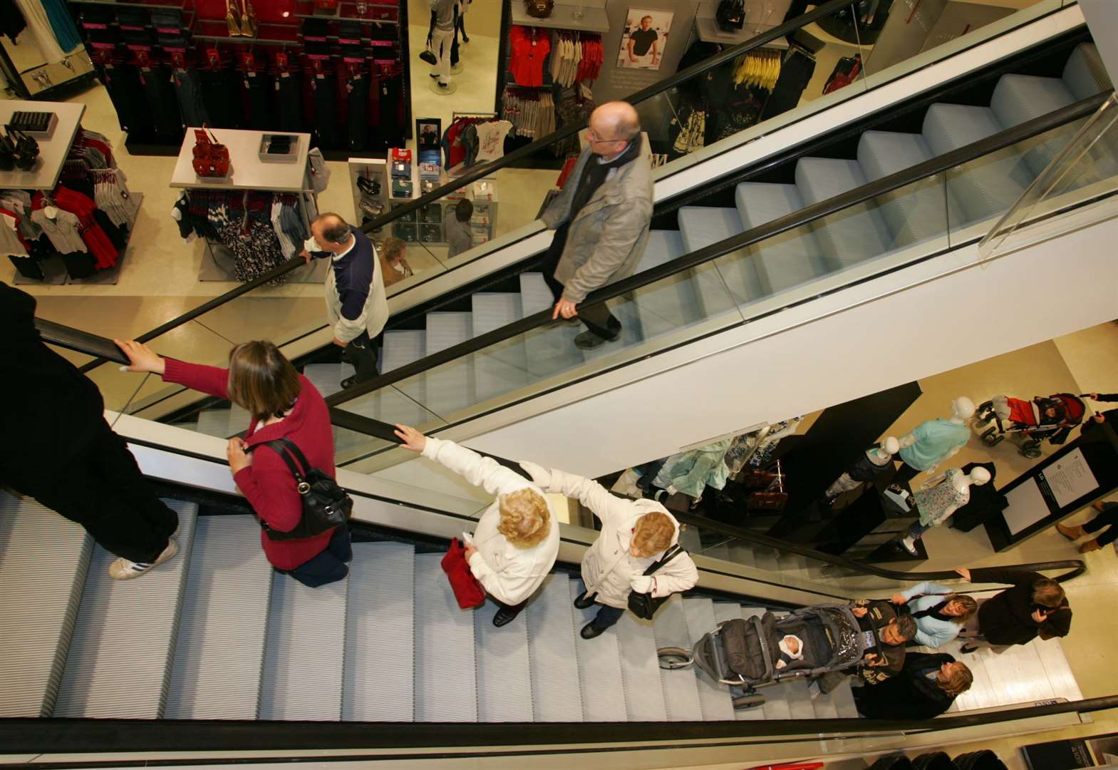 Shoppers enjoying the three-storey Debenhams on its opening day in March 2008
