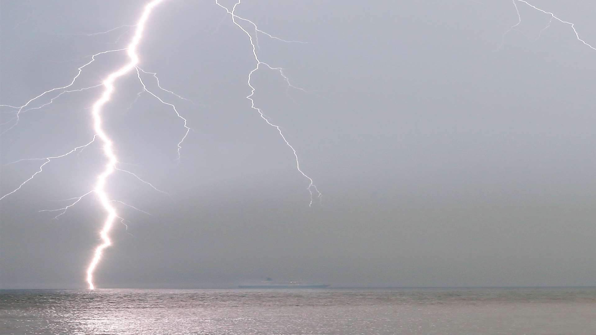 A ship on the horizon as lightning strikes. Picture: Shaun Fellows/Shine Pix Ltd