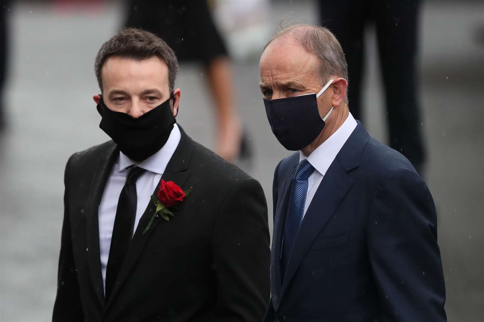 SDLP leader Colum Eastwood and Taoiseach Micheal Martin arrive at St Eugene’s Cathedral (Brian Lawless/PA)