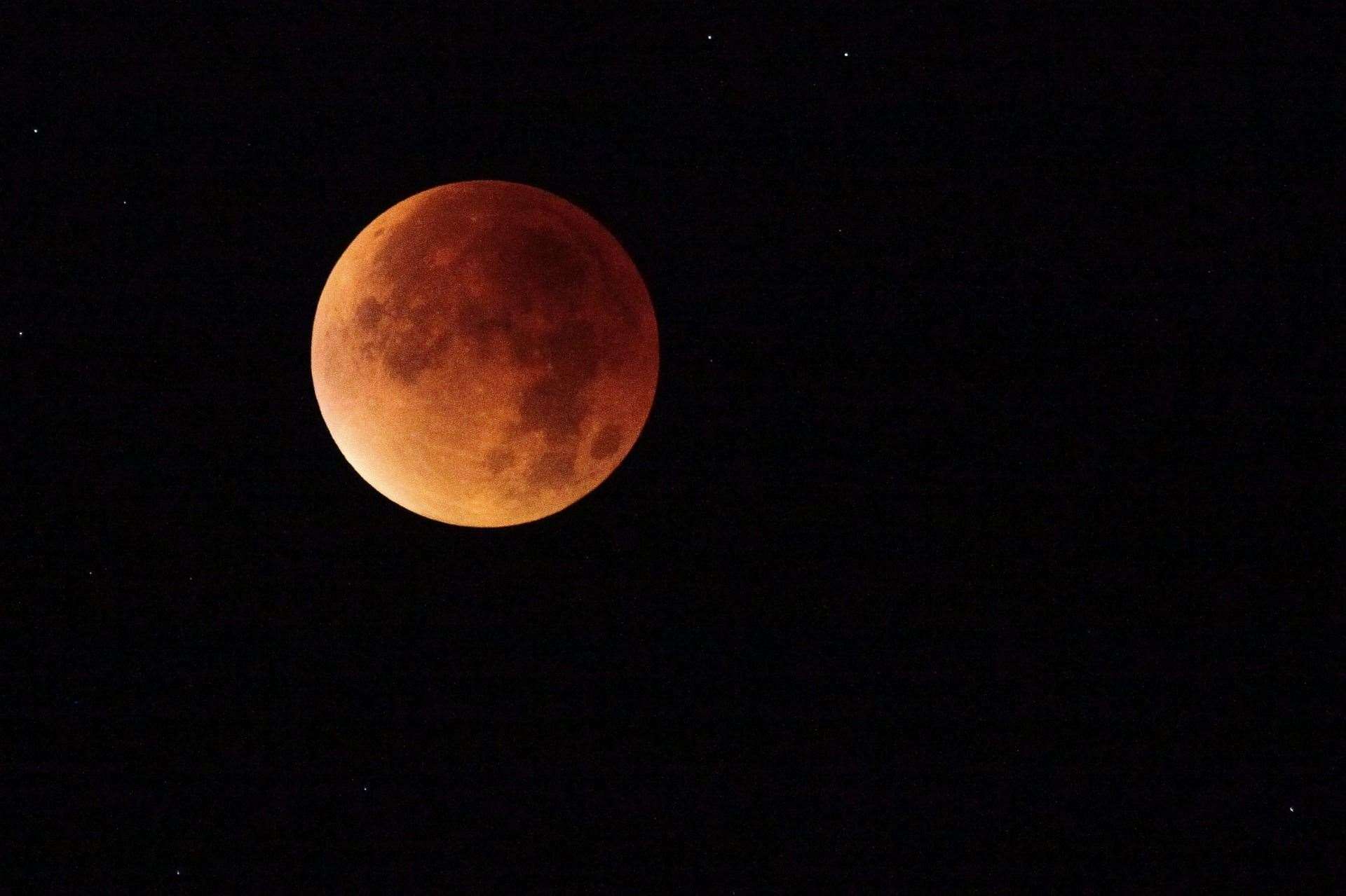 A partial lunar eclipse could make the moon appear red