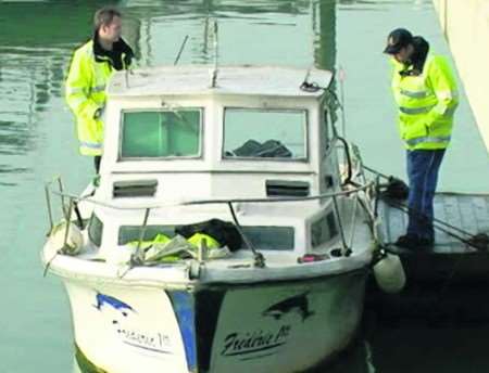 Coastguards on board the 18ft white fishing yacht Frederic in Ramsgate harbour - picture Mike Pett