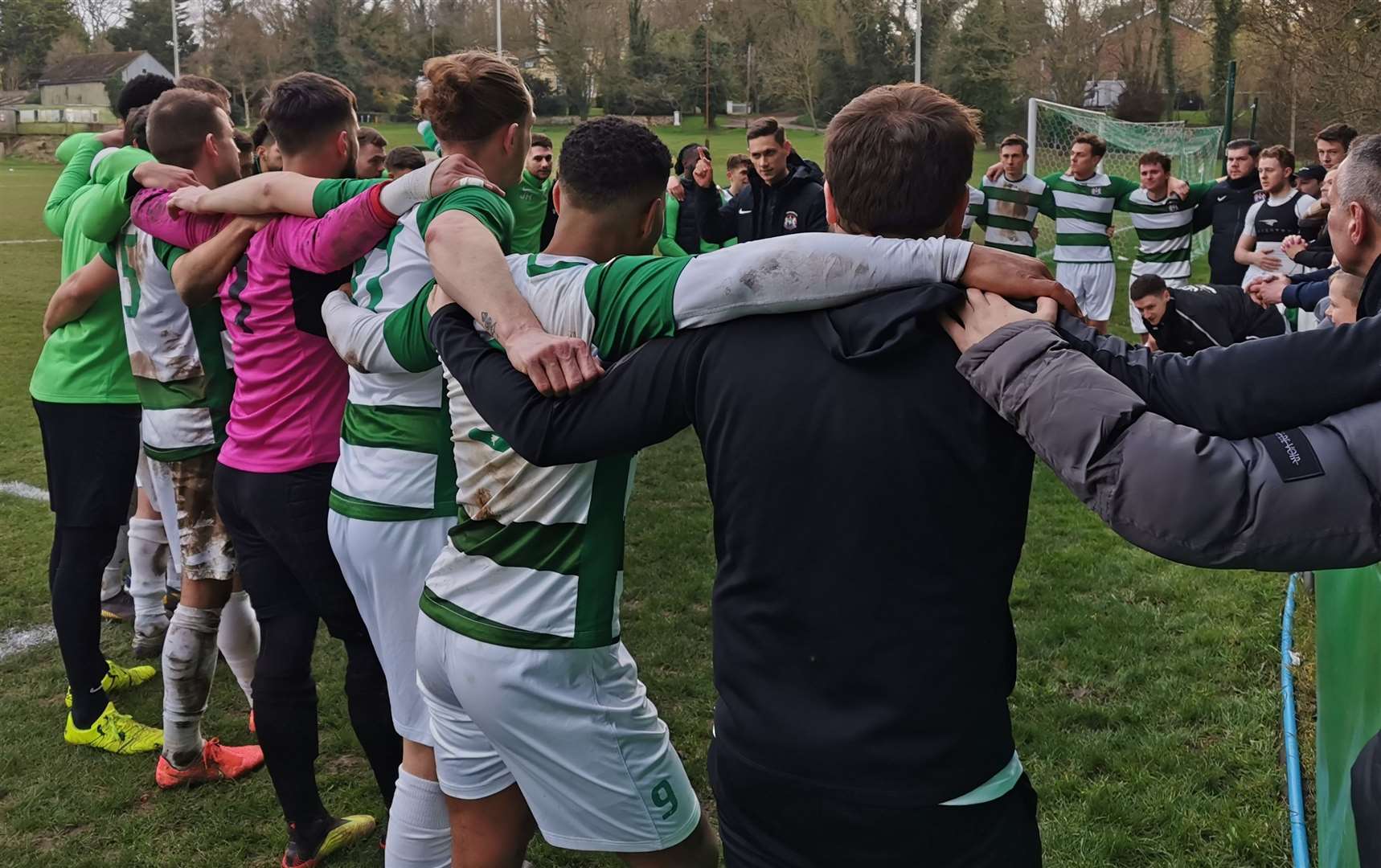 Corinthian players in their post-match huddle after beating Leighton Town in the FA Vase quarter-finals.