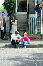 Danny and rap star Mike Skinner have a chat on the pavement