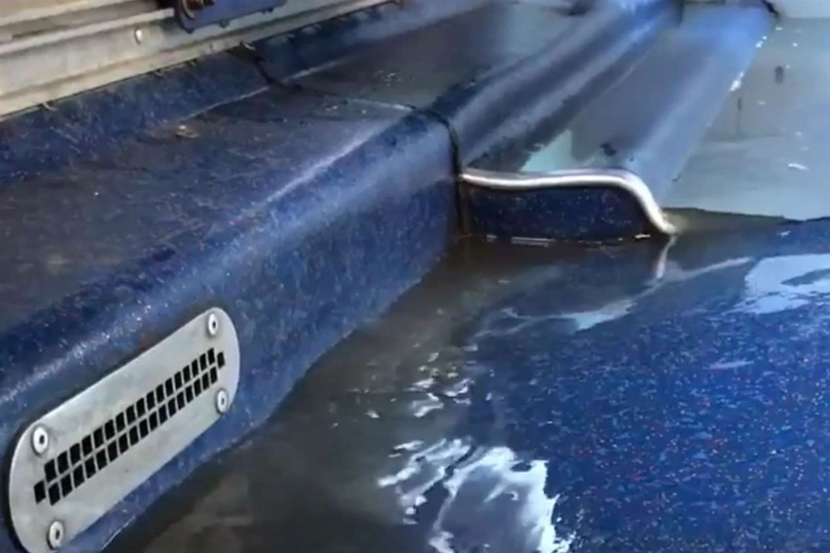 The bus user captured on video dirty water rushing under her feet