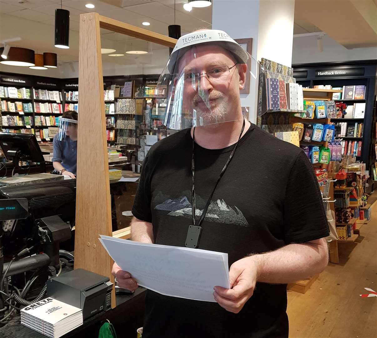 Michael Venner, the manager of Waterstones in Tunbridge Wells, shows off his PPE