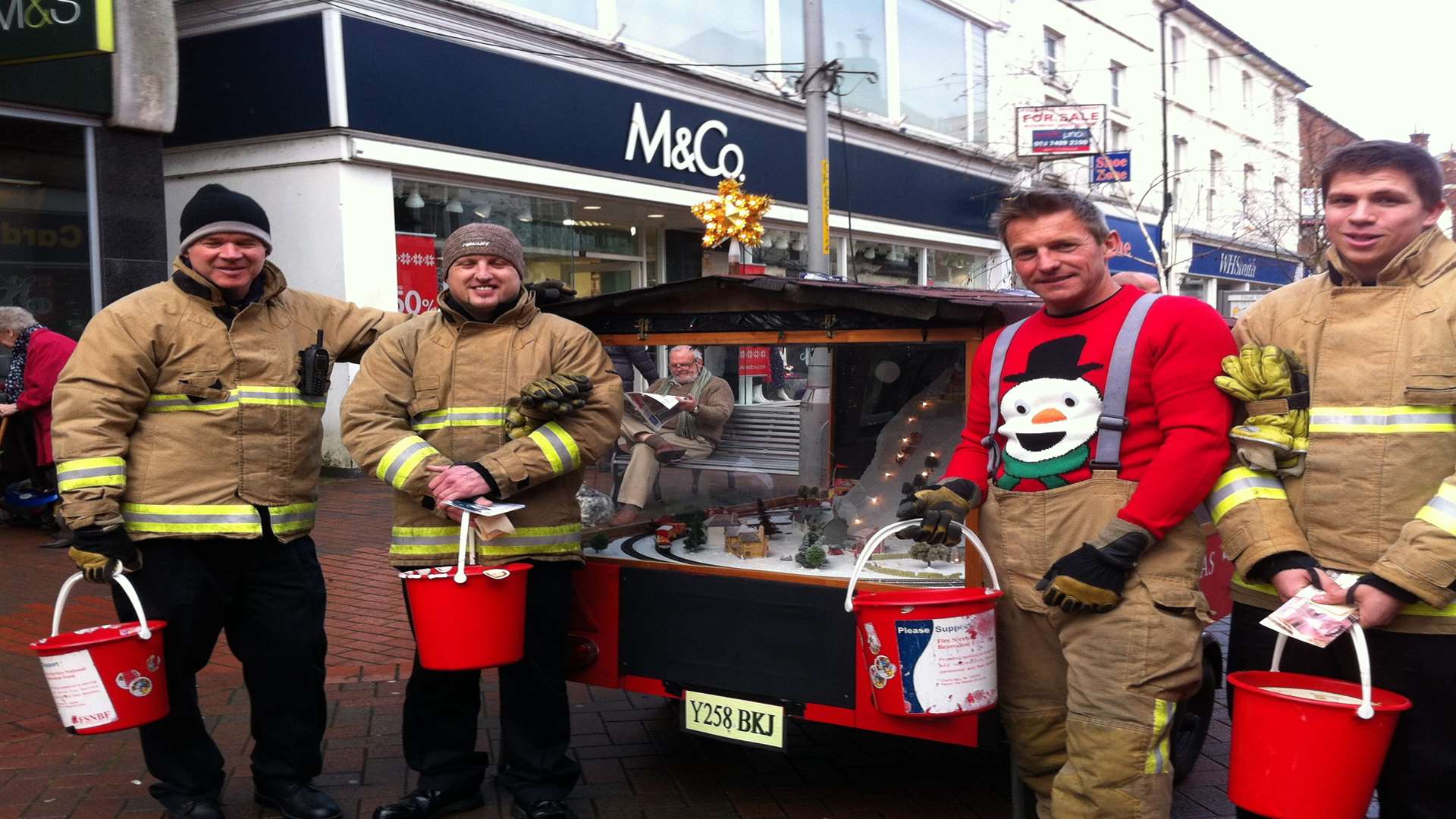 Firefighters Bob Bale, Craig Sheridan, Rob Taylor and Sam Hursey collecting outside Marks & Spencer in Deal High Street