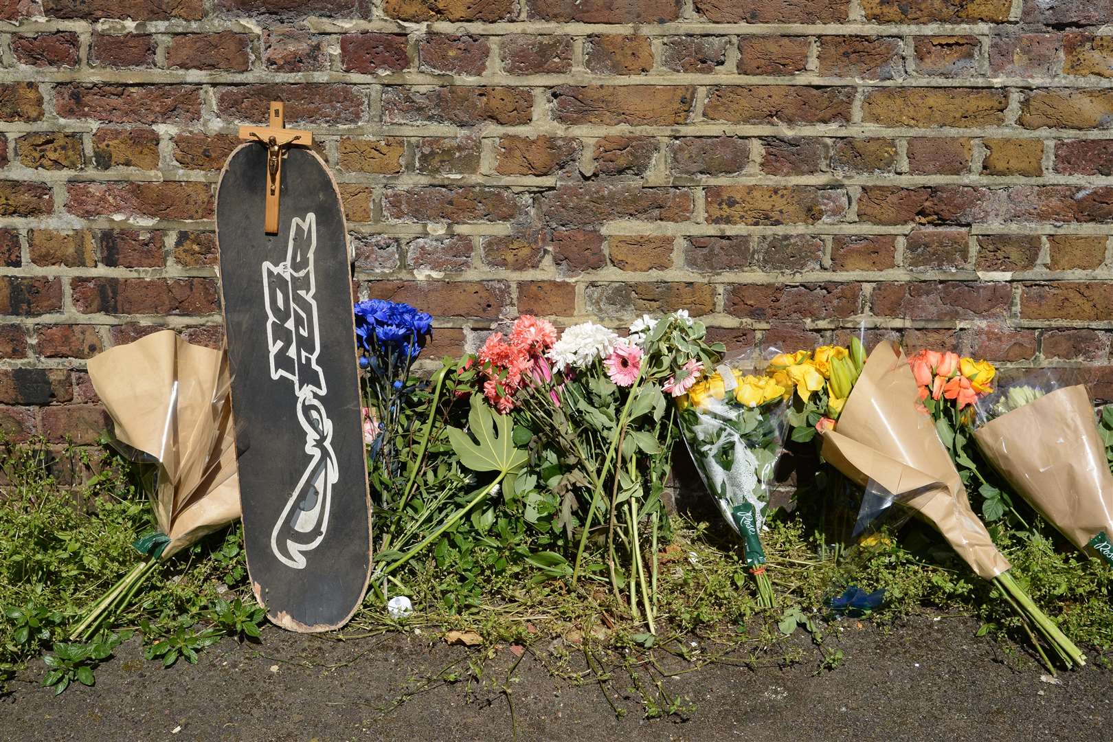 Flowers and tributes left to Phillip Marshall at the Foord Road viaduct