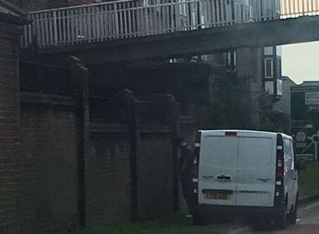Caught short? This van white van relieves himself on one of Canterbury's busiest roads.