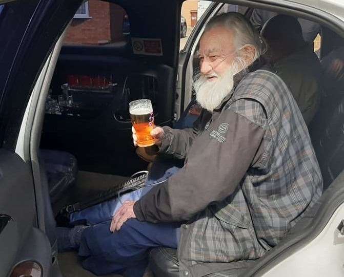 Sheppey pensioner Arthur Chew relaxed with a beer in a limo as friends redecorated his home. Picture: Rocky Troina