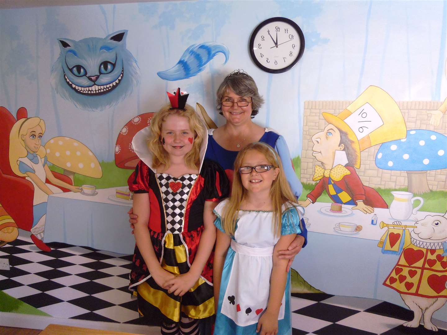 Past times: opening of the Mad Hatter's Tea Room in Baileys Coffee Shop in Sittingbourne High Street with owner Sally Reeve, customers Danielle and Phoebe Hatt - and the original back-to-front clock