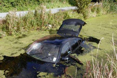 A BMW X6 submerged in a stream near Herne Bay