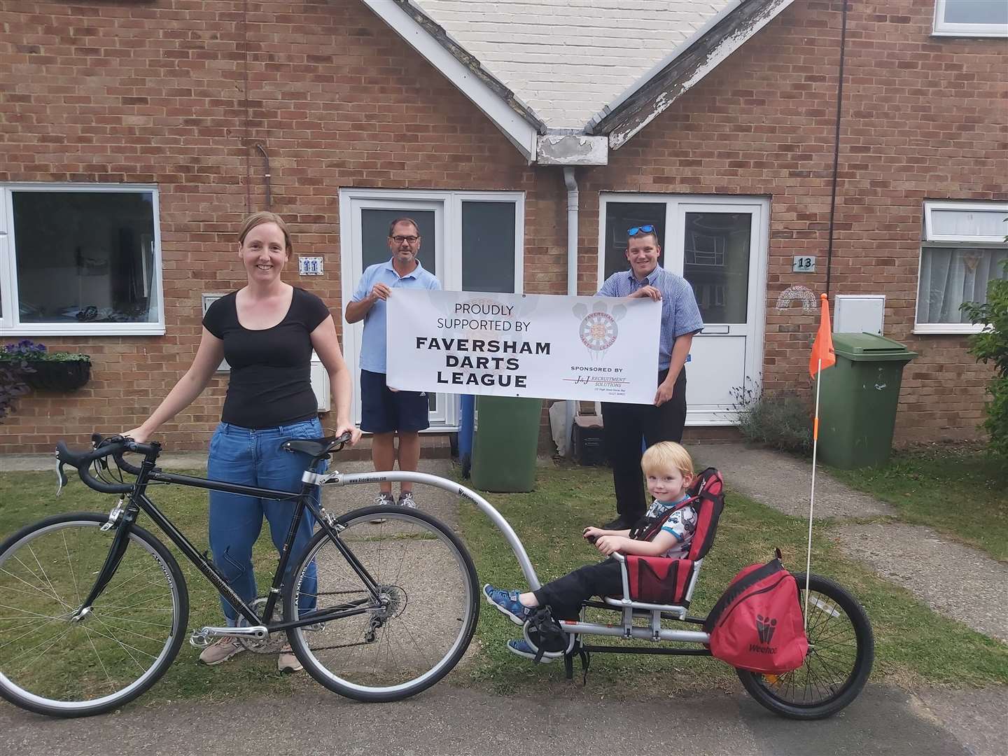 Kerry Pearce, from Faversham, had cycled to Seasalter with her three-year-old son Alfred. Pictured with new trailer donated by the Faversham Darts League