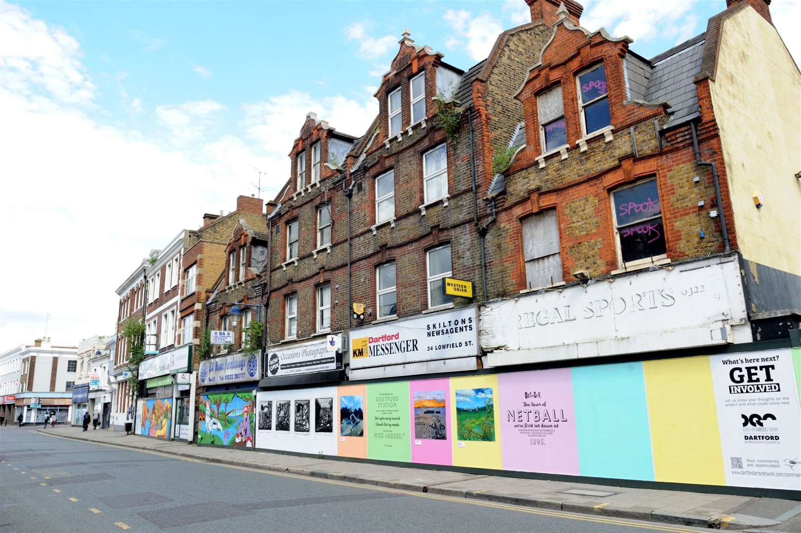 Colourful boardings once adorned the derelict Lowfield Street site but work is now underway Picture: Simon Hildrew